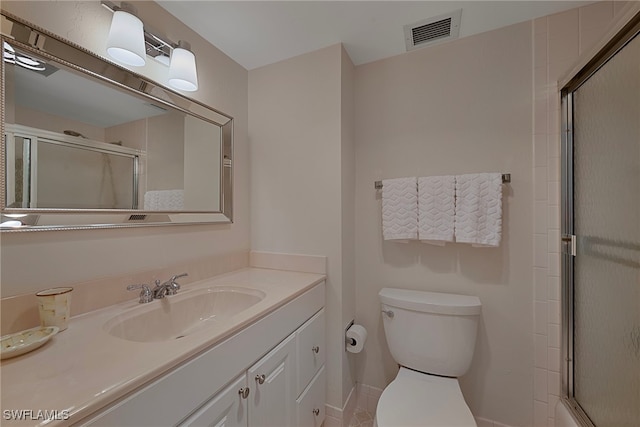1977 Gulf Shore Blvd N Unit 306, Naples, FL 34102 - bathroom with a shower with door, toilet, vanity, and baseboards