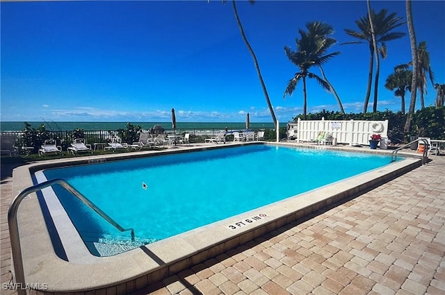 1977 Gulf Shore Blvd N Unit 306, Naples, FL 34102 - community pool featuring a patio and fence