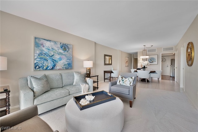 1977 Gulf Shore Blvd N Unit 306, Naples, FL 34102 - carpeted living room featuring baseboards and tile patterned floors