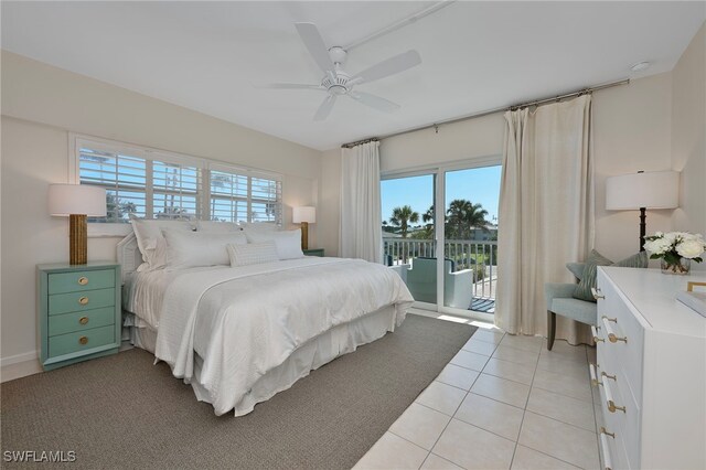 1977 Gulf Shore Blvd N Unit 306, Naples, FL 34102 - bedroom featuring access to exterior, multiple windows, ceiling fan, and light tile patterned floors