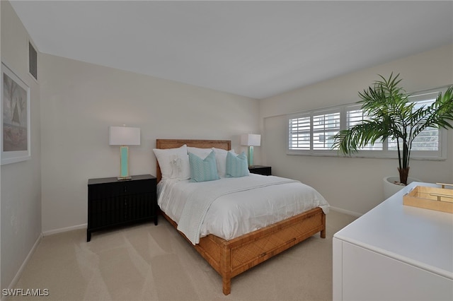 1977 Gulf Shore Blvd N Unit 306, Naples, FL 34102 - bedroom with light colored carpet and baseboards