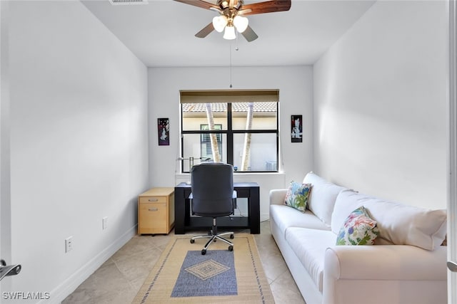 home office featuring ceiling fan and light tile patterned floors