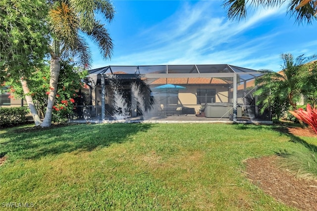 view of yard featuring a patio area and a lanai