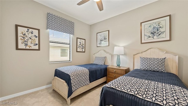 bedroom with ceiling fan and light carpet