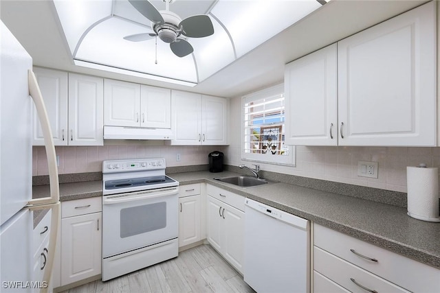 kitchen featuring sink, white cabinets, decorative backsplash, ceiling fan, and white appliances