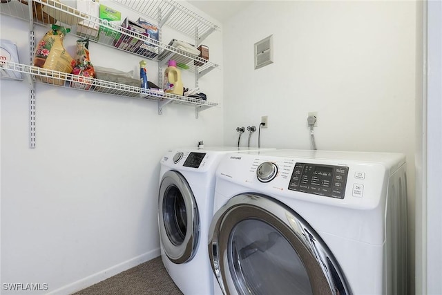 laundry room featuring independent washer and dryer and carpet