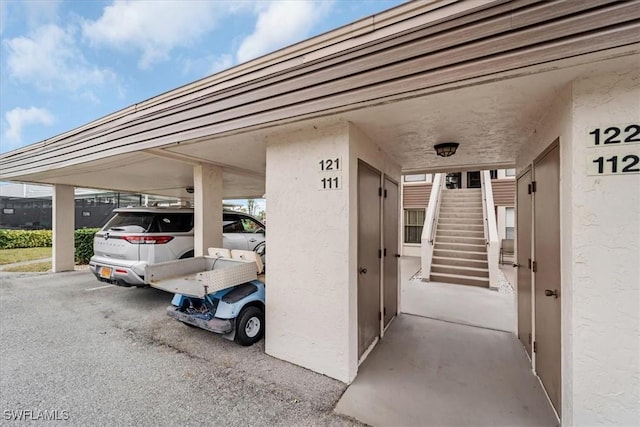 view of parking / parking lot with a carport