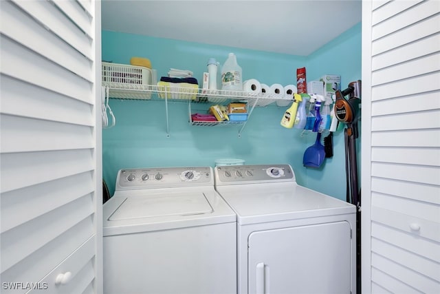 clothes washing area featuring washing machine and clothes dryer