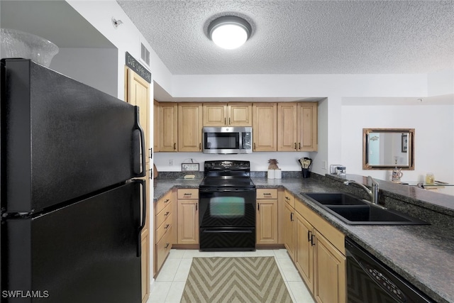 kitchen with sink, black appliances, a textured ceiling, and light tile patterned flooring