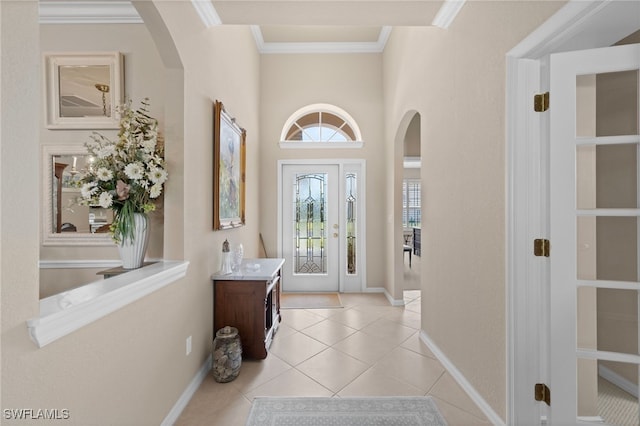 tiled entrance foyer with ornamental molding