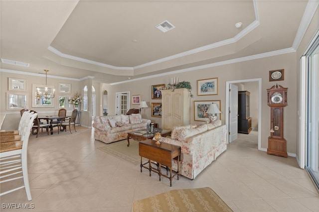 living room with light tile patterned flooring, ornamental molding, a raised ceiling, and an inviting chandelier