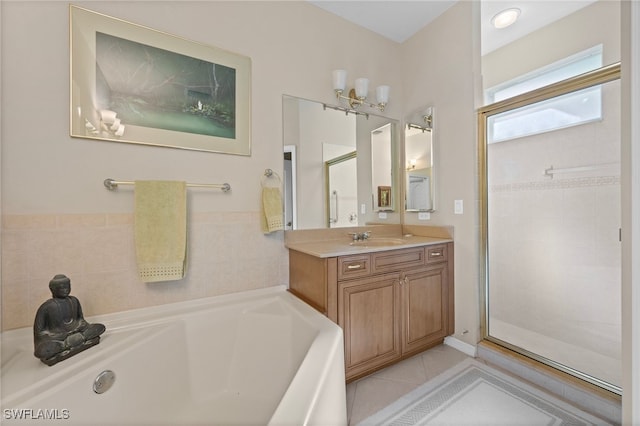 bathroom featuring vanity, tile patterned flooring, and plus walk in shower