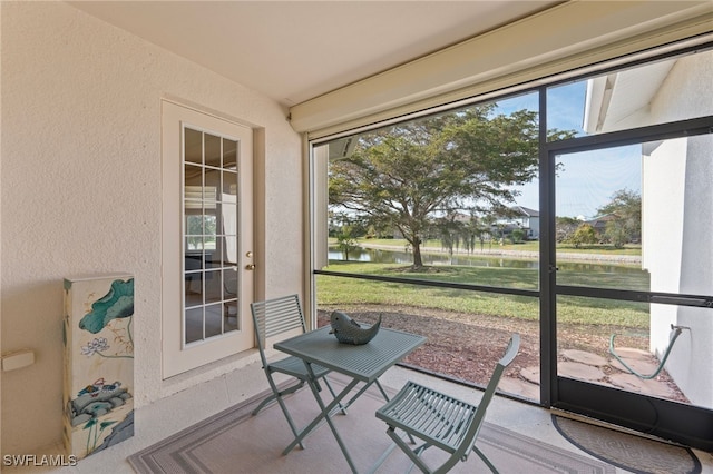 sunroom with a water view