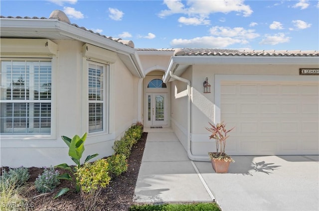 entrance to property featuring a garage