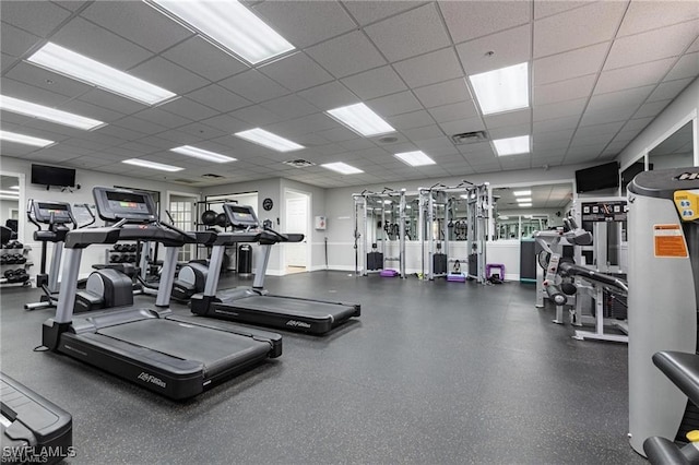 workout area with a paneled ceiling