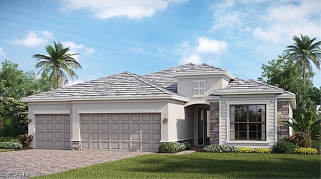 view of front of home featuring a garage and a front lawn