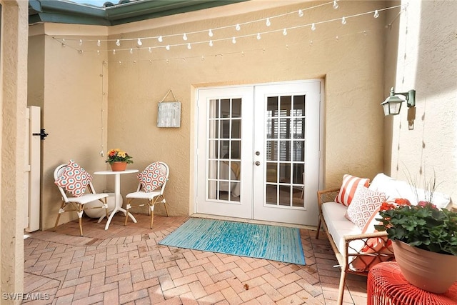 property entrance with french doors and a patio