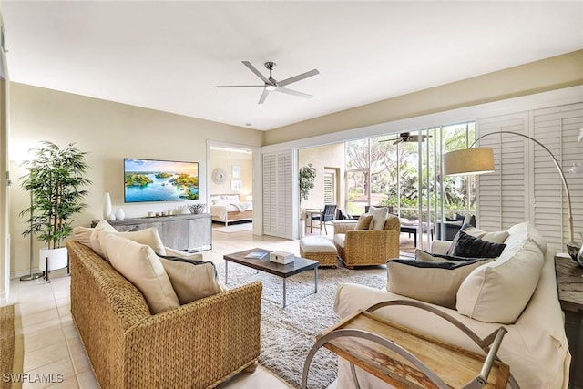 tiled living room with ceiling fan