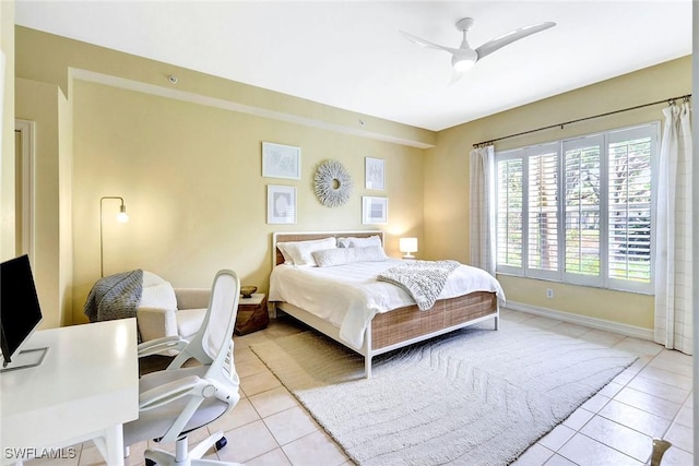 bedroom featuring light tile patterned floors and ceiling fan