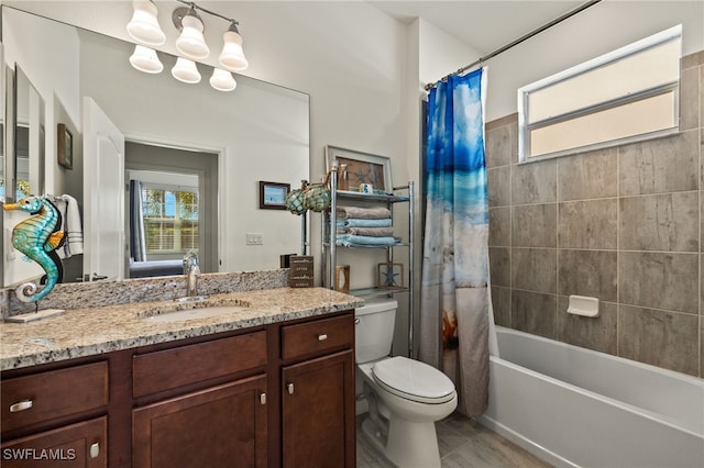 full bathroom with vanity, shower / bath combination with curtain, and toilet