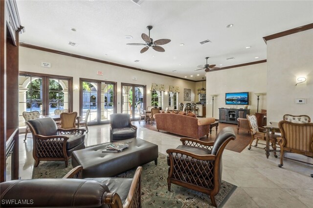 living room with french doors, ceiling fan, and ornamental molding