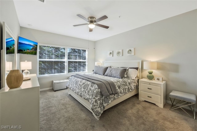 bedroom featuring light colored carpet and ceiling fan