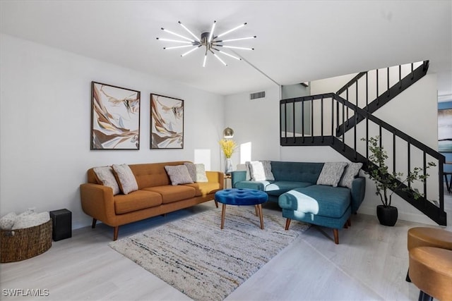 5570 Woodrose Ct Unit 2, Fort Myers, FL 33907 - living area with a chandelier, wood finished floors, and stairs