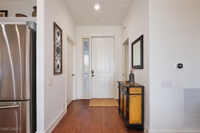 corridor featuring dark hardwood / wood-style floors