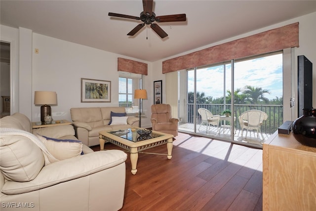 living room featuring hardwood / wood-style flooring and ceiling fan