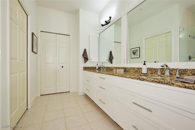 bathroom with tile patterned flooring and vanity