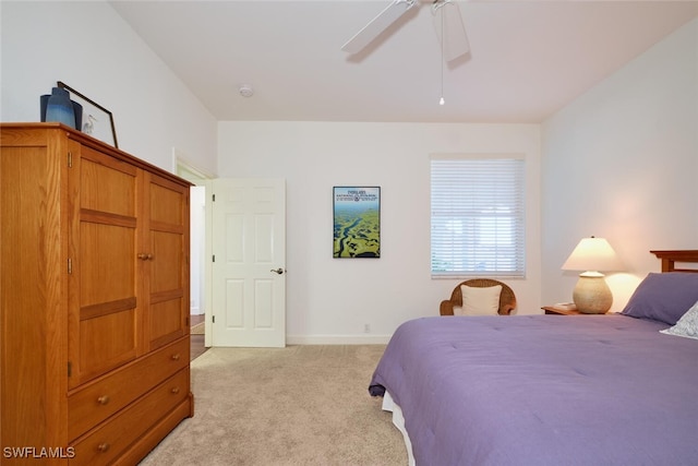 bedroom with light colored carpet and ceiling fan