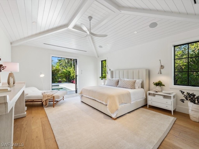 bedroom with light hardwood / wood-style flooring, lofted ceiling with beams, multiple windows, and access to outside