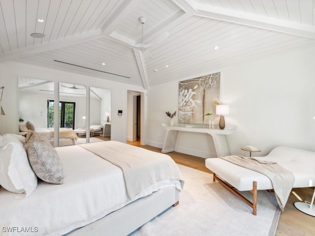 bedroom with lofted ceiling with beams, light hardwood / wood-style floors, and wooden ceiling