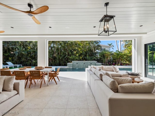 interior space with ceiling fan