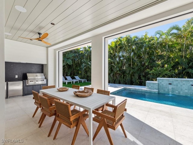 exterior space featuring an outdoor kitchen, area for grilling, ceiling fan, and a patio area