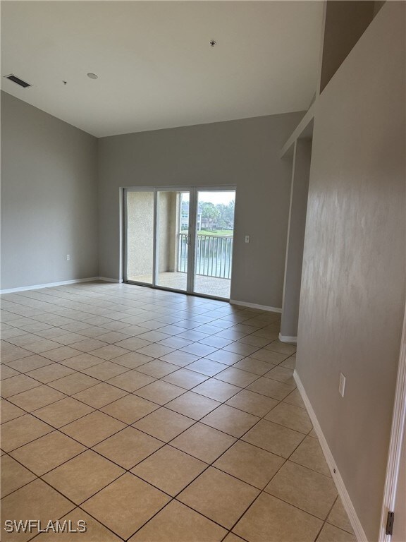 spare room with light tile patterned floors