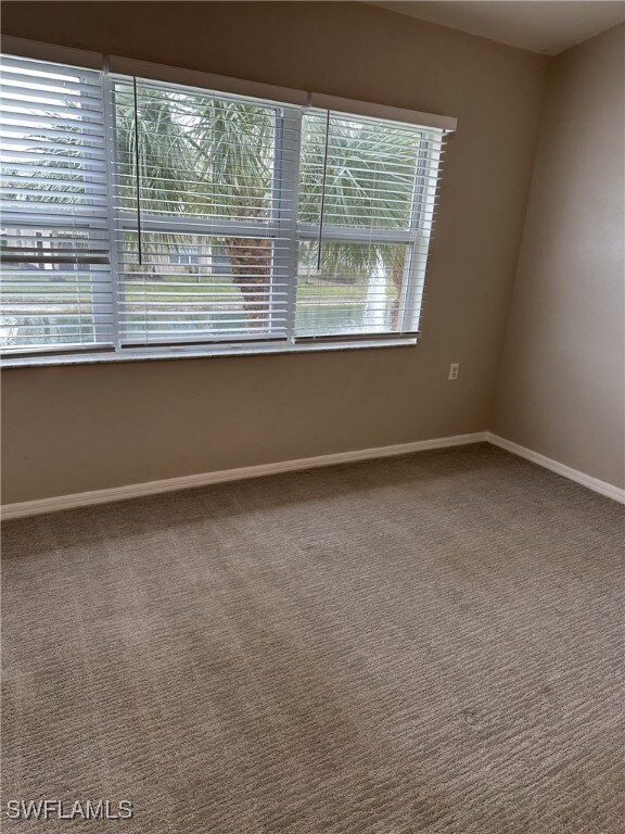 empty room with carpet flooring