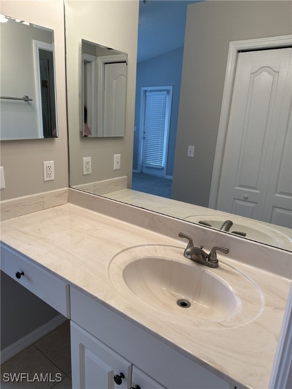 bathroom with vanity and tile patterned flooring