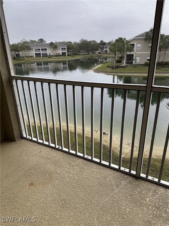 balcony featuring a water view