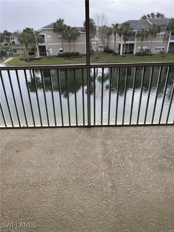 view of swimming pool with a water view