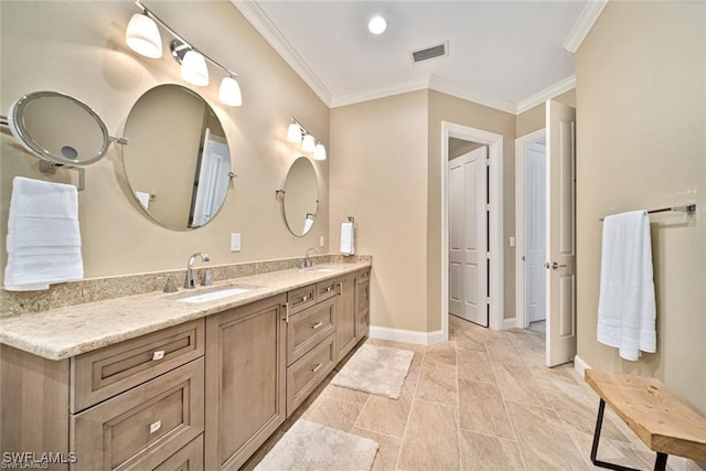 bathroom featuring vanity and crown molding