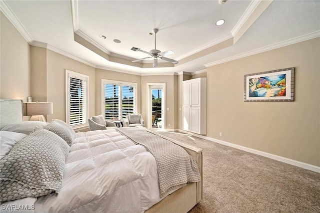 bedroom with carpet floors, ornamental molding, access to outside, ceiling fan, and a tray ceiling