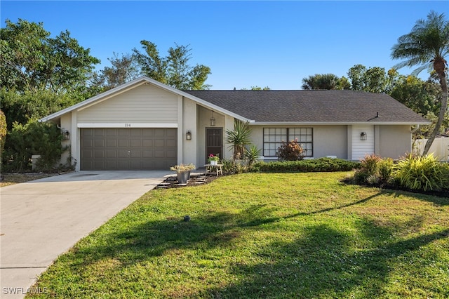 ranch-style home with a garage and a front lawn