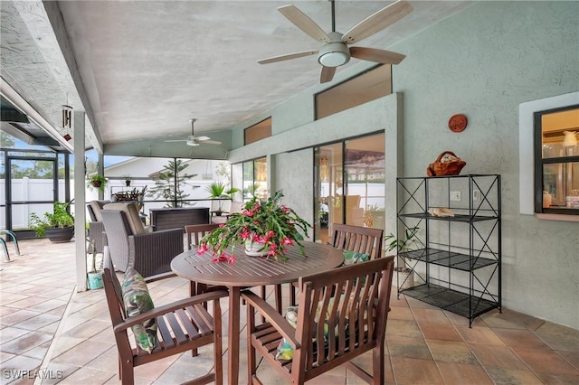 sunroom featuring ceiling fan