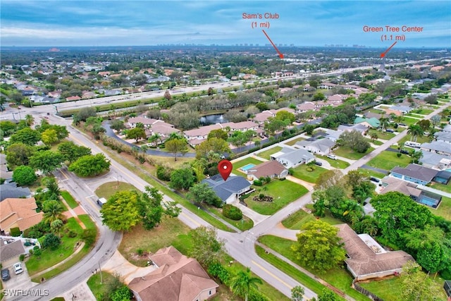 birds eye view of property with a residential view