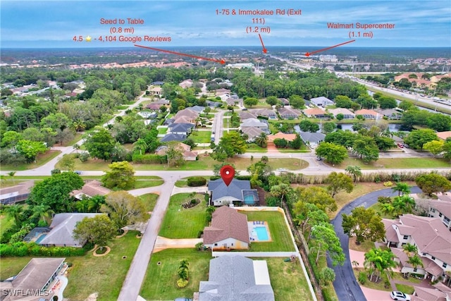 birds eye view of property with a residential view