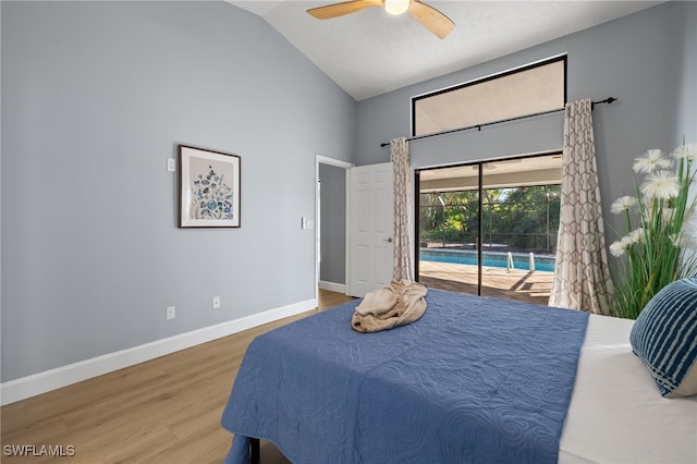 bedroom with access to exterior, a sunroom, ceiling fan, wood finished floors, and baseboards