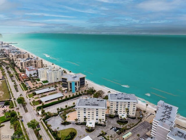 aerial view featuring a water view and a view of the beach