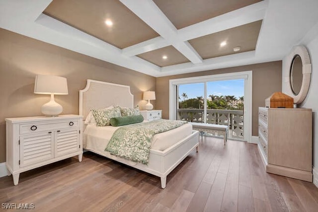 bedroom with hardwood / wood-style flooring, coffered ceiling, and beam ceiling