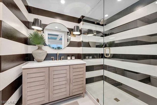 bathroom with vanity and a shower